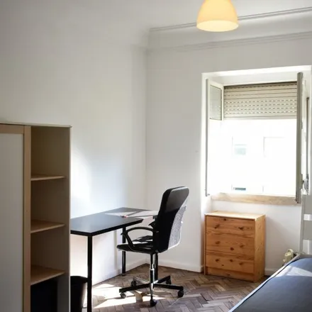 Rent this 7 bed room on Rua José Estevão 46 in 1150-200 Lisbon, Portugal