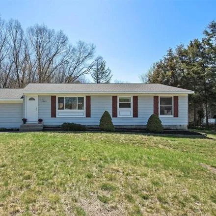 Buy this 3 bed house on 10690 Settlewood Drive Southeast in Lowell Charter Township, MI 49331