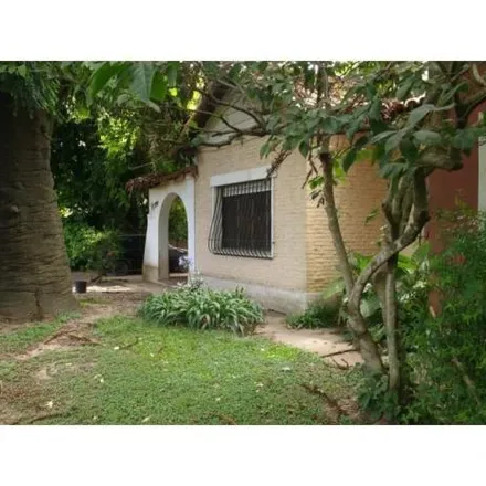Buy this 4 bed house on Calle 419 - Avenida Arana in Partido de La Plata, Villa Elisa