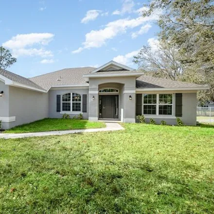Buy this 4 bed house on 1100 Raywood Street Southeast in Palm Bay, FL 32909