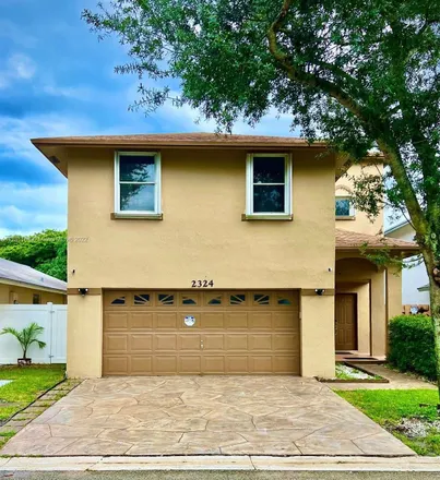 Buy this 4 bed house on 2324 Northwest 33rd Terrace in Coconut Creek, FL 33066