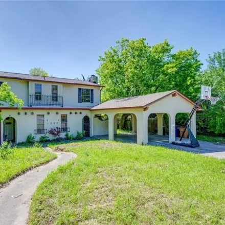 Buy this 4 bed townhouse on 1207 Fairbanks Drive in Austin, TX 78752