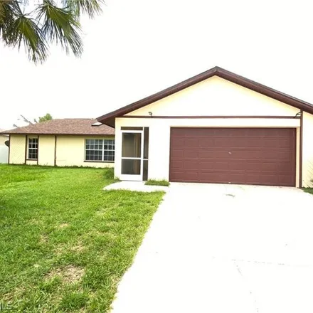 Rent this 3 bed house on 1106 NE 6th Pl in Cape Coral, Florida