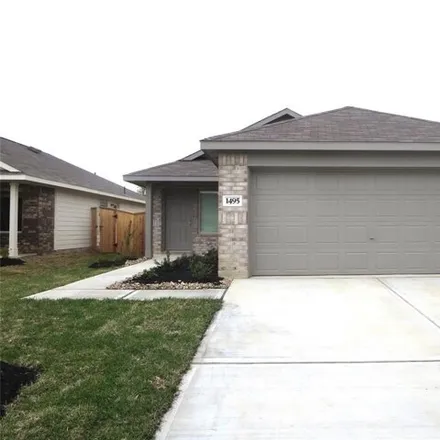Rent this 3 bed house on Las Cuevas Drive in Conroe, TX 77301