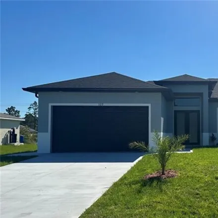 Rent this 4 bed house on 575 Wabasso Avenue in Lehigh Acres, FL 33974
