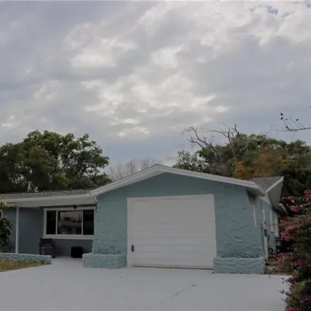 Buy this 5 bed house on 3841 Chaffey Drive in Elfers, FL 34652