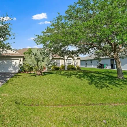 Buy this 4 bed house on 1653 Southwest Pleasant Lane in Port Saint Lucie, FL 34984