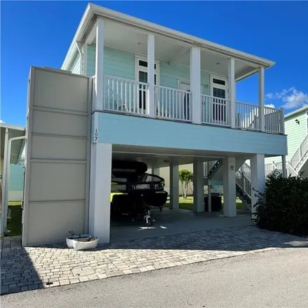 Rent this 2 bed house on 114 Northeast Portside Drive in Ocean Breeze, Martin County