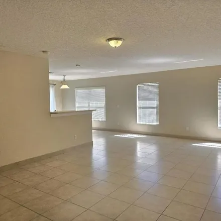 Rent this 3 bed apartment on 998 Windrose Drive in Orange County, FL 32824