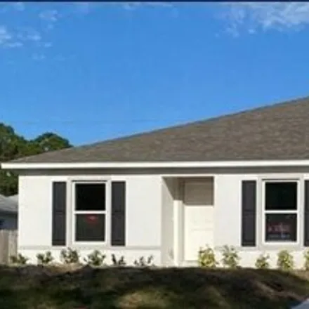 Buy this 4 bed house on 719 Haryestor Avenue Southwest in Palm Bay, FL 32908
