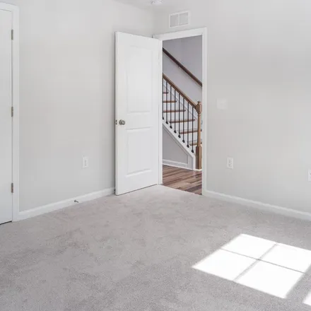 Rent this 4 bed townhouse on Rosepine Drive in Cary, NC 27519