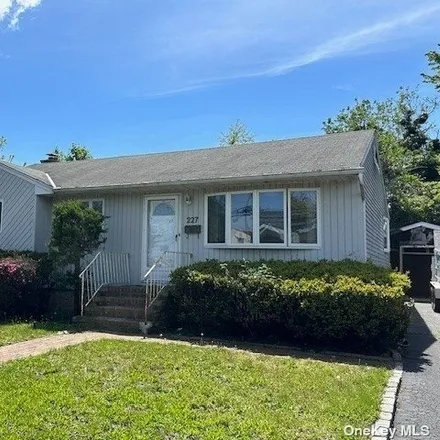 Buy this 3 bed house on 227 Bergen Court in Copiague, NY 11726