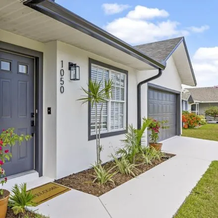 Buy this 3 bed house on 1036 Sheridan Avenue Northwest in Palm Bay, FL 32907