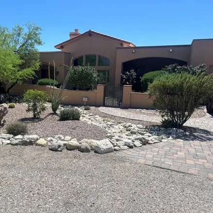 Buy this 4 bed house on 7300 East Wikieup Circle in Pima County, AZ 85750