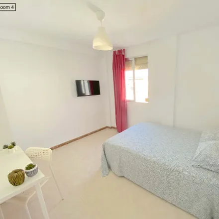 Rent this 4 bed room on Calle El Pedroso in 41008 Seville, Spain