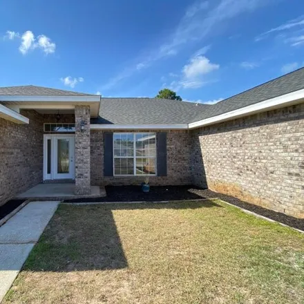 Rent this 4 bed house on 8214 Cosica Boulevard in Navarre, FL 32566