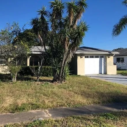 Rent this 3 bed house on 5761 Dolores Drive in Elfers, FL 34690