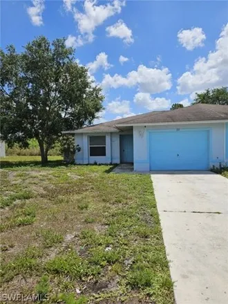 Rent this 2 bed house on 713 Jenna Ave S in Lehigh Acres, Florida