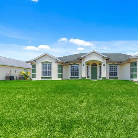 Buy this 4 bed house on 831 Southwest Idol Avenue in Port Saint Lucie, FL 34953