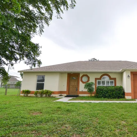 Buy this 3 bed house on 1112 Southwest Bayamo Avenue in Port Saint Lucie, FL 34953