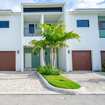 Rent this 3 bed townhouse on 4346 Northwest 8th Court in Breezeswept Park Estates, Plantation