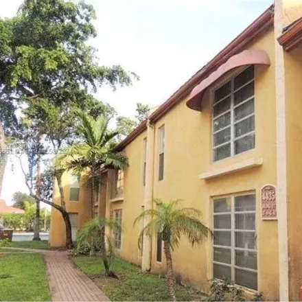 Rent this 2 bed condo on 4462 Treehouse Lane in Tamarac, FL 33319