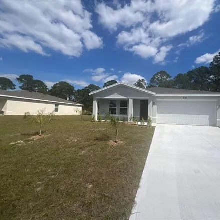 Rent this 3 bed house on 683 Weaver Road Southwest in Palm Bay, FL 32908