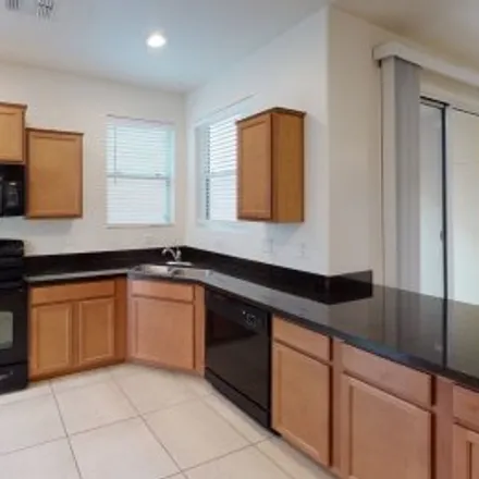 Rent this 4 bed apartment on 883 South Almira Avenue in Cooley Station North, Gilbert