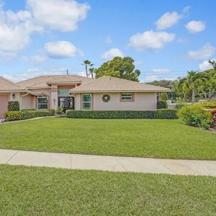 Buy this 4 bed house on 9001 Cypress Hollow Drive in Palm Beach Gardens, FL 33418