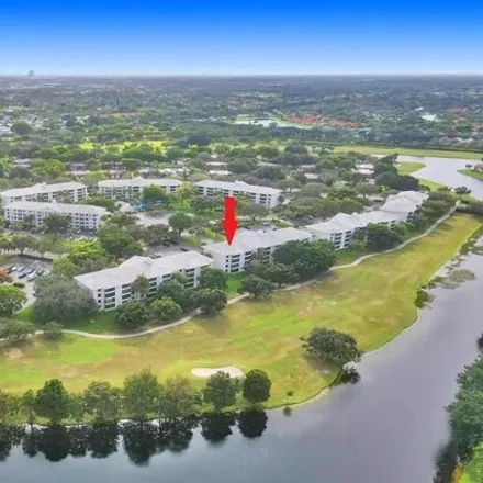 Buy this 2 bed condo on Pine Island Ridge Golf Course in 9400 Poinciana Place, Pine Island Ridge