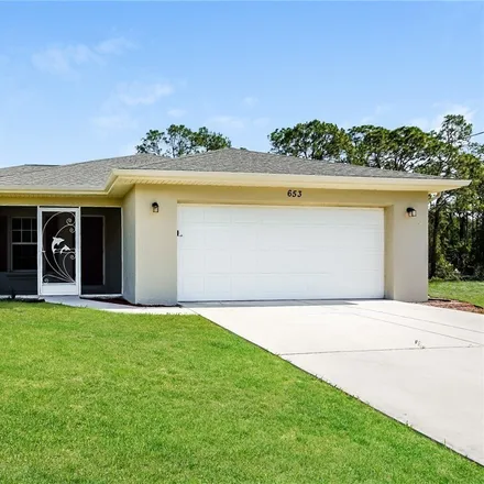 Rent this 3 bed house on 653 Ladd Street in Lehigh Acres, FL 33974