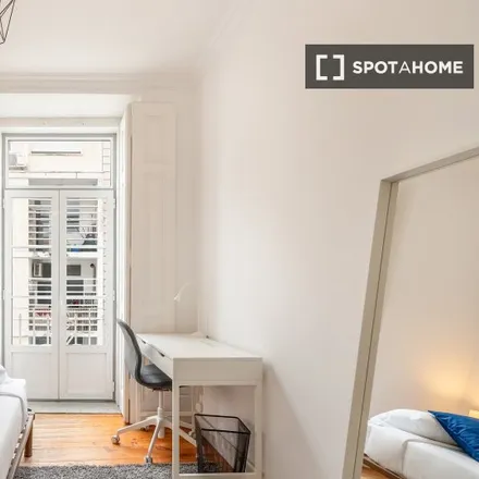 Rent this 4 bed room on Rua de João de Deus 17 in 1200-667 Lisbon, Portugal