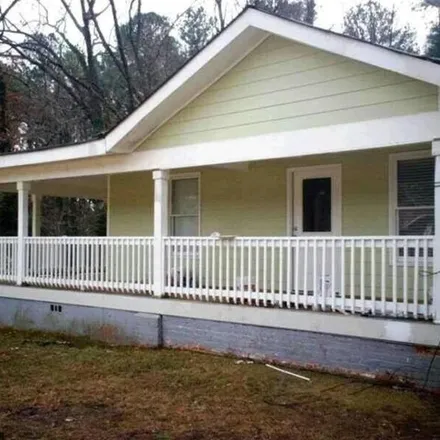 Rent this 4 bed house on 1657 Columbia Drive in Belvedere Park, GA 30032