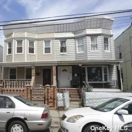 Buy this 8 bed townhouse on 89th Avenue in New York, NY 11418