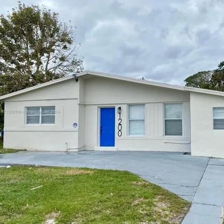 Buy this 4 bed house on 1202 West 24th Street in Riviera Beach, FL 33404