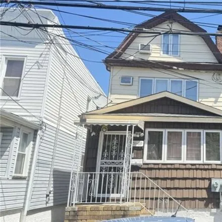 Buy this 4 bed house on 51-69 72nd Place in New York, NY 11378