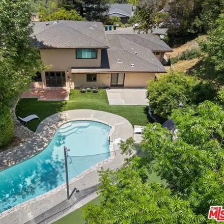 Buy this 5 bed house on 4743 Dunman Ave in Woodland Hills, California