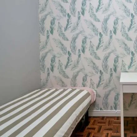Rent this 3 bed room on Spicy Café in Rua da República da Bolívia, 1500-544 Lisbon