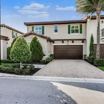 Rent this 4 bed townhouse on 118 Diamante Way in Jupiter, Florida