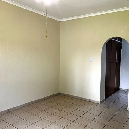 Rent this 3 bed apartment on Maraboe Avenue in Rooihuiskraal, Golden Fields Estate