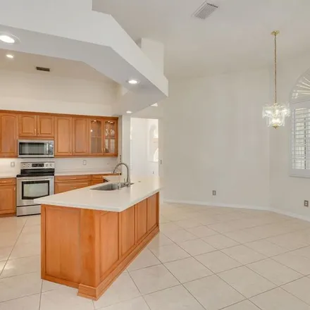 Rent this 4 bed apartment on 3695 Siena Lane in East Lake, FL 34685