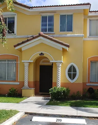 Rent this 3 bed townhouse on 1528 Southeast 24th Court in Homestead, FL 33035