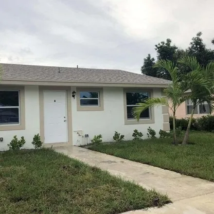 Rent this 3 bed house on 220 Perry Ave Unit A in Greenacres, Florida