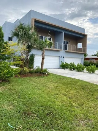 Buy this 3 bed townhouse on 1133 Northeast 23rd Terrace in Pinehurst Village, Pompano Beach
