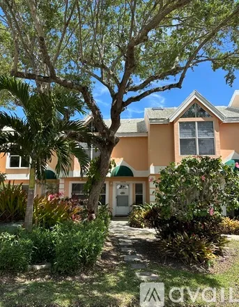 Rent this 2 bed townhouse on 1406 Coral Oak Lane