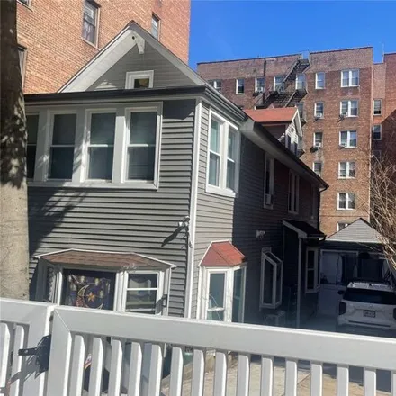 Buy this 7 bed house on 65-71 Booth Street in New York, NY 11374