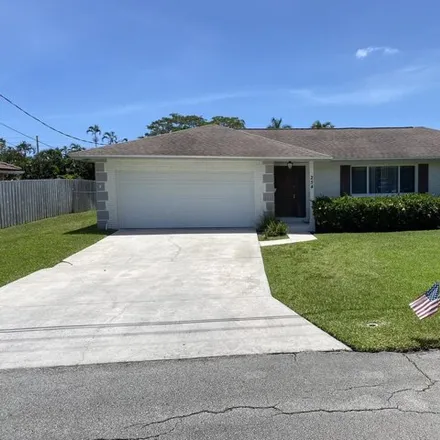Rent this 3 bed house on 254 NW 11th Ave in Boca Raton, Florida