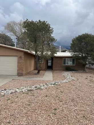 Rent this 3 bed house on Elwood Place Northeast in Enchanted Park, Albuquerque