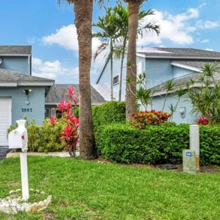 Buy this 3 bed house on 3883 Island Club Cir W in Lake Worth, Florida