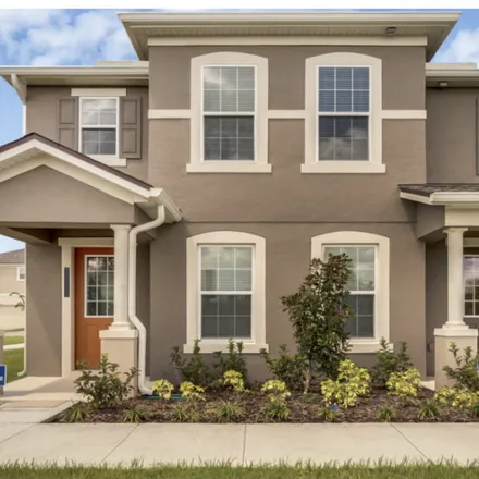 Rent this 3 bed townhouse on Central Florida GreeneWay in Orange County, FL 32832